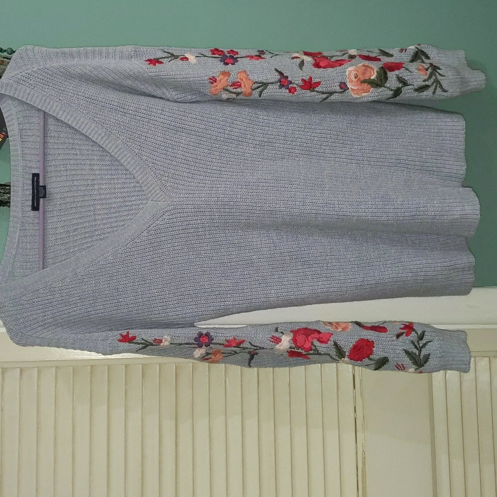 Embroidered Flowers on a Blue Sweater